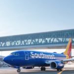 Southwest plane in front of pedestrian bridge at LaGuardia Airport